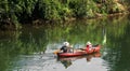 Father and Daughter Canoeing on the River Royalty Free Stock Photo